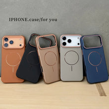 Five iPhone cases in different colors on a wooden surface with a gray background.